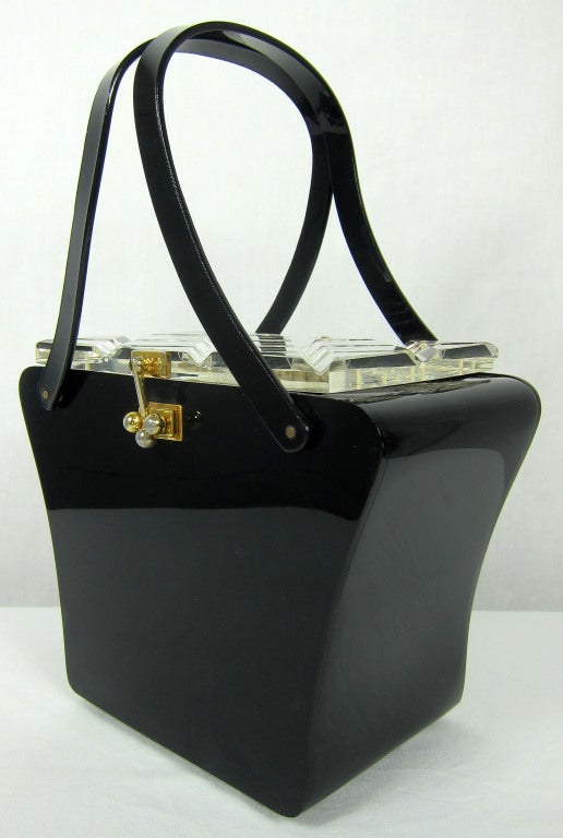 1950'S  black lucite with clear cross hatch top, cross hatch clear lid , gold hardware, double handle.

How adorable with a pair of white gloves? 

6.5