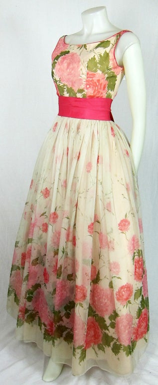 Highly collectable Emma Domb maxi flowing chiffon dress. Lovely for a garden wedding!  Pink roses, green leaves dark pink sash.. Fully lined with attached crinoline.
Bust: 36