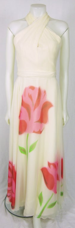 Fabulous flowing chiffon with huge flower floor length dress.  The bodice is a criss cross in the front halter.  It is fully lined.  The designer is Jerand's Jersey Girl.  

BUST:  34
