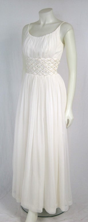 Beautiful flowing chiffon long dress with sequin rhinestone waist.  Built in slip with extra zipper, and acetate lining. Metal zipper. Perfect for a summer party or beach garden wedding. 

Bust 34