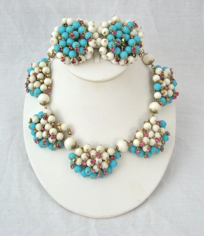 FABULOUS SUMMER NECKLACE AND EARRINGS..TURQUOISE, WHITE BEADED WITH DANGLING PINK CRYSTALS..

Necklace
Length:16