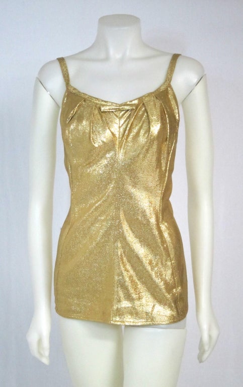 Hot as can be gold lame bathing suit with metal zipper. By Cole of California. Circa 1950. 
Bust:30
Was it: 28