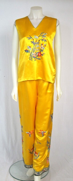 1930's 1940's yellow satin embroidered pajama set. Beautiful trim at the hem of pajama pants.. Elastic waist (we replaced) .

Top
Bust 40