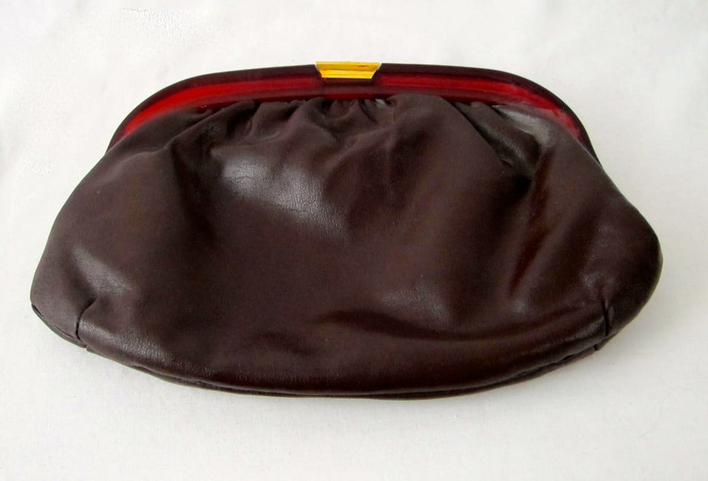 Lovely brown leather clutch with root beer lucite frame gold metal closure and permanent mirror inside and metal zipper pocket. Fits Cell phone and much more!  Very Good Condition!
  11