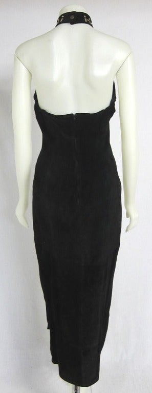 Amazing black suede halter dress with gold studded neck and bodice. Lined and Zipper elastic under arms for the bust. Excellent !

Bust: 32