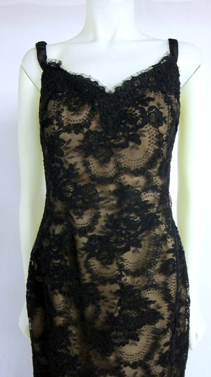 Figure flattering Victor Costa Black Lace Illusion formal ball gown dress with ever so slight longer length in back.Nude lining and boning, Satin elastic straps, zipper along the back .

Size 12

Please e-mail us with questions and for a Pay Pal