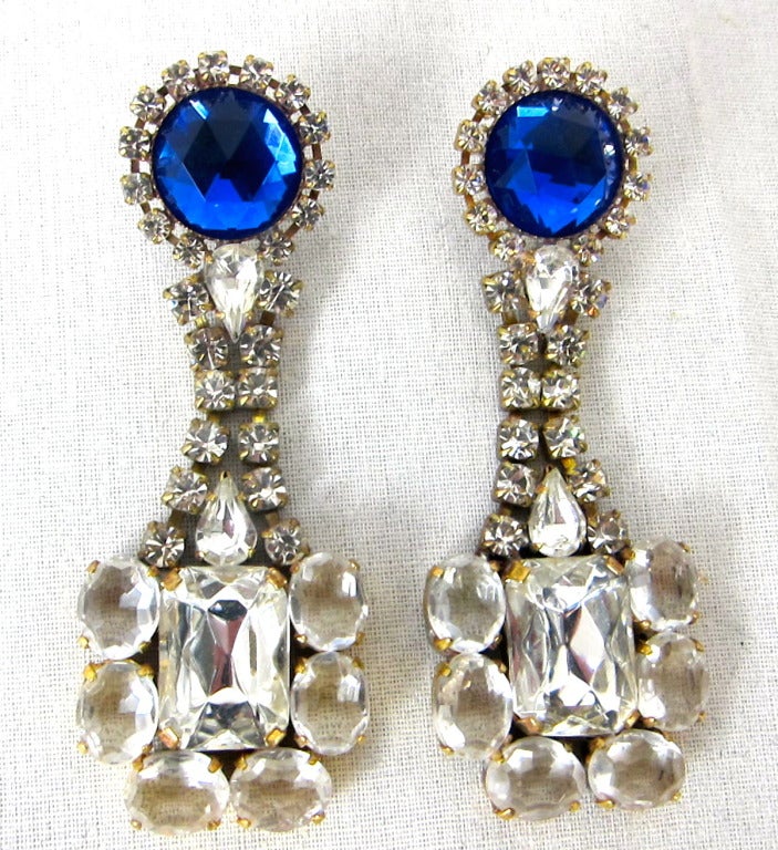 Beautiful Round Blue  Sapphire  with two rows of clear rhinestones leading to bold Clear Flower dangle. 
 Length 3