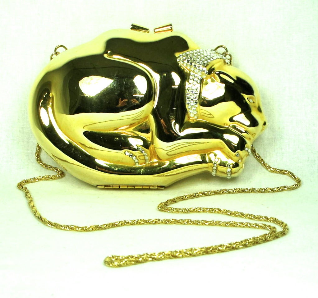 Gold bejeweled  Cat shaped minaudieres with  rhinestone bow and toes. Shoulder strap that hides. Hong Kong..
  6-1/2