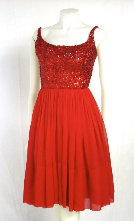 Hot red party dress. Santa Baby!  Red sequin bodice with chiffon skirt.  Acetate lining and metal zipper. Built in bra:

Bra: 32B
Bust: 34