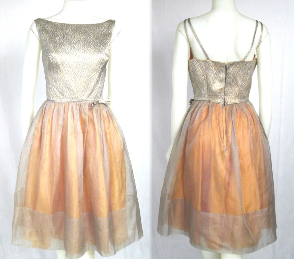 1960's golden metallic brocade bodice with Nude organza skirt and orange acetate lining. sweet waist bow, metal zipper double straps. Fun cocktail party dress! 

Bust:  34