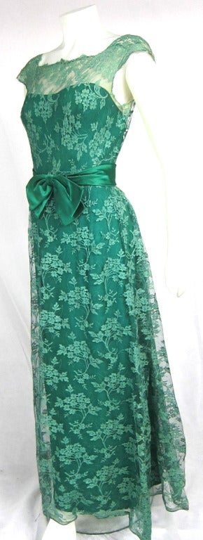 1960s Malcolm Starr Green Illusion Lace Dress with Big satin waistband and bow. Low V back. Metal zipper. A charmer! 

Bust: 36