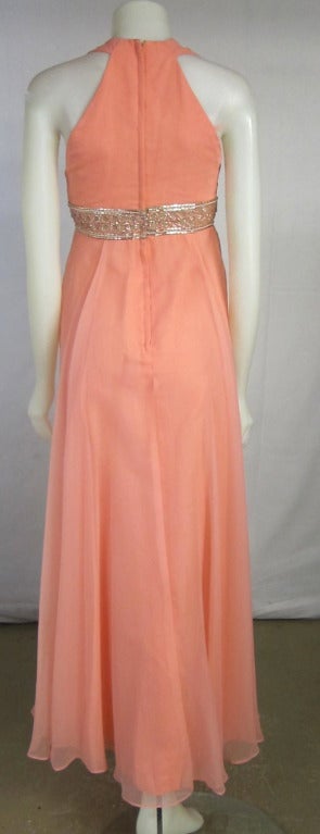 Gorgeous Chiffon dress! Pink and beautiful. Heavily beaded empire waist. Fully lined.

Bust: 32