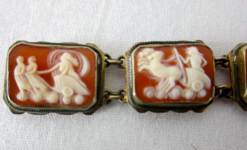 Gorgeous bracelet- 7 carved shell 'chariots of the spirit