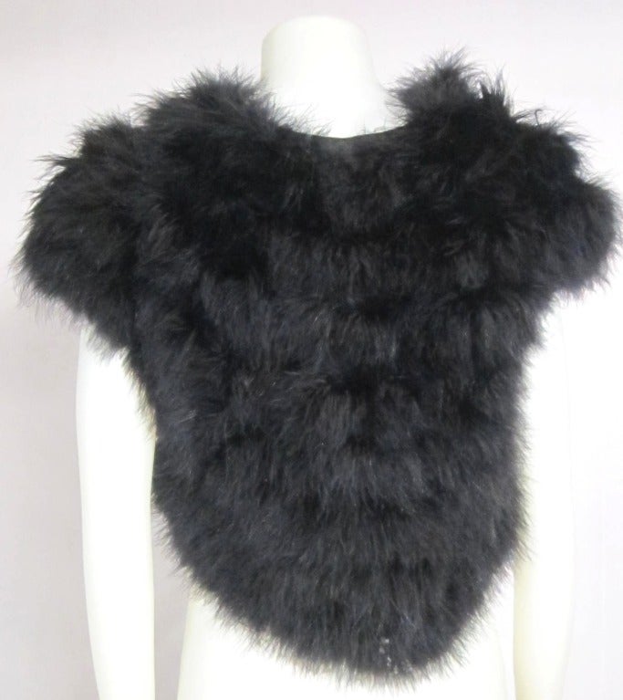 Vintage Black Fluffly Ostrich Feather  vest/bolero size medium. Lined. Hook Eye closure

Size Medium