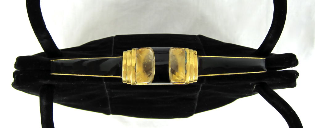 Featured is a beautiful Art Deco black velvet evening bag from Paris. It is made of the softest velvet with an incredible  black, gold, glass  ART DECO closure.<br />
The interior has center purse with cream and black satin and a kiss closure. On