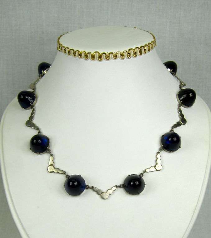 Featured is a vintage deco era transparent  royal blue glass dome silver choker . The sterling silver links are soldered into v-shaped links in between each large