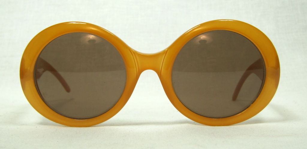 Fantastic pair of 1960's butterscotch Jackie O sunglasses with original squeeze case. <br />
<br />
Please e-mail us wit questions as we do not accept returns.<br />
We invite you to visit our boutique located at 3234 Sacramento Street, San