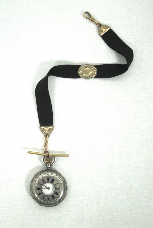 Featured is a lovely woman's pocket watch with fob made by Gallet & Co. It is the 