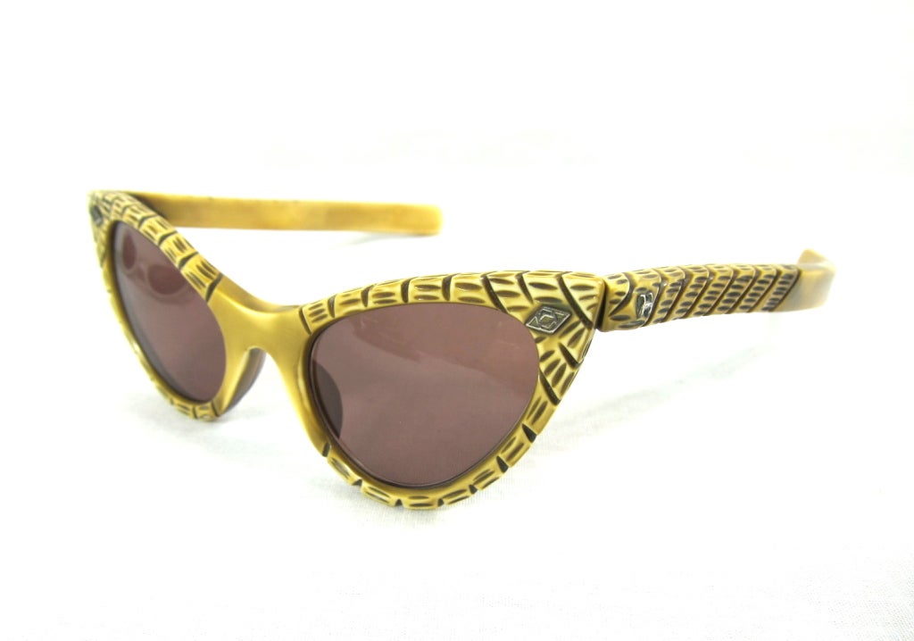 Vintage Bamboo styled 1940 Cat Eye Sunglasses.(authentic 1940's) These glasses were acquired from an eyeglass family company that began designing glasses in the 1930's.  The lenses are newly replaced.<br />
 <br />
Front width: 5