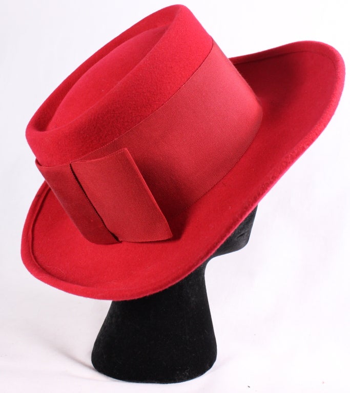 VINTAGE TEXAN RED ADOLF II WIDE BRIM HAT

This is a fantastic red hat....brings Texan to my mind!
It is made by Adolfo II New York Paris
It has a wide brim love big bad red bow...imagine with a pair of skinny jeans...

Circumference: a nice