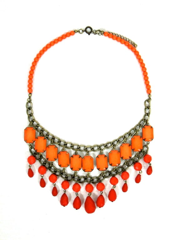 This is a great necklace from 1960/1970's. It is an alive  two tone orange color reminiscent of the the Golden Gate Bride ( we S.F.er's are celebrating our bridge this year!) One layer is prong set  faceted salmon color plastic stones secured by