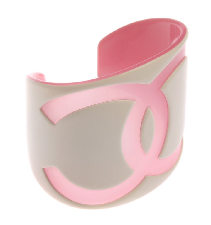 This interesting cuff bracelt is two layers of resin white cut back to pink.<br />
*Measurements*<br />
This cuff measures 2 1/4