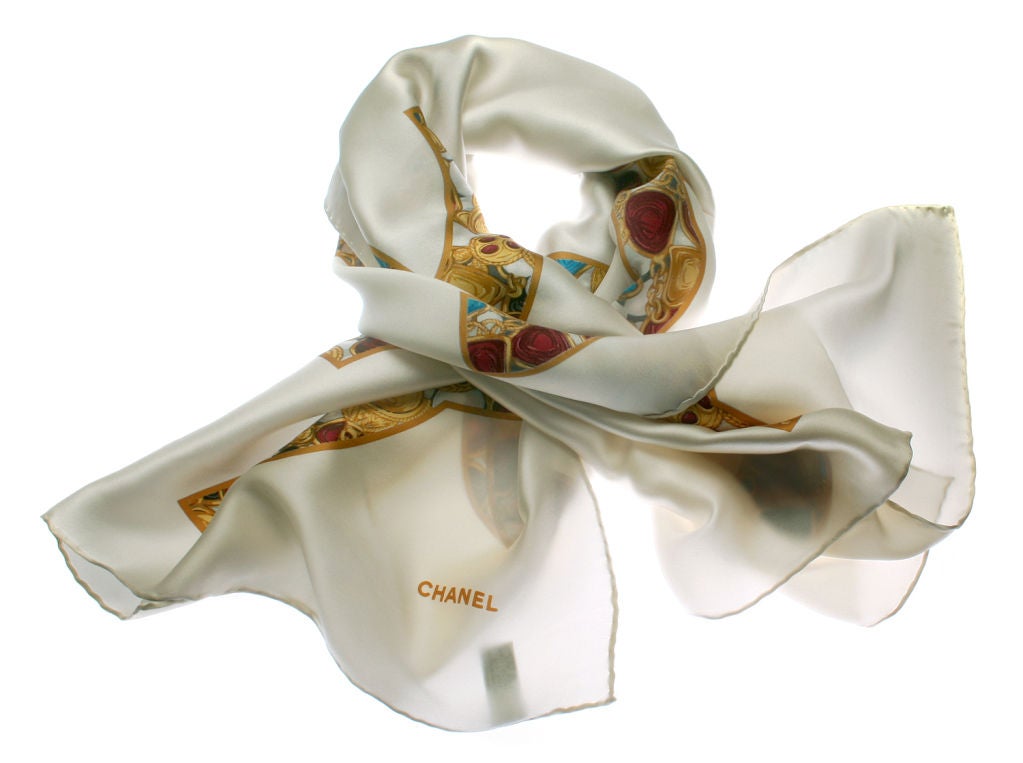 This is an unusual CHANEL Scarf, fun and graphic the logos are filled with examples of our favorite CHANEL jewelry.