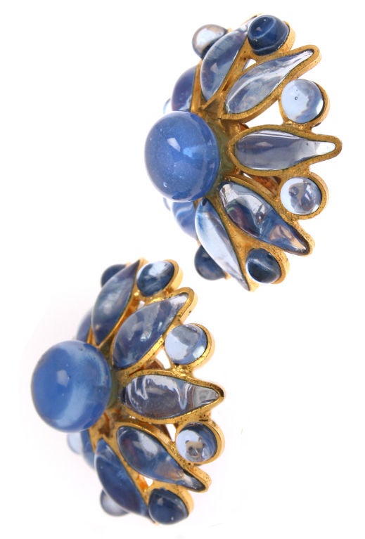 These are beautiful cornflower blue poured glass earrings.  They are unsigned, but I believe them to be early CHANEL.