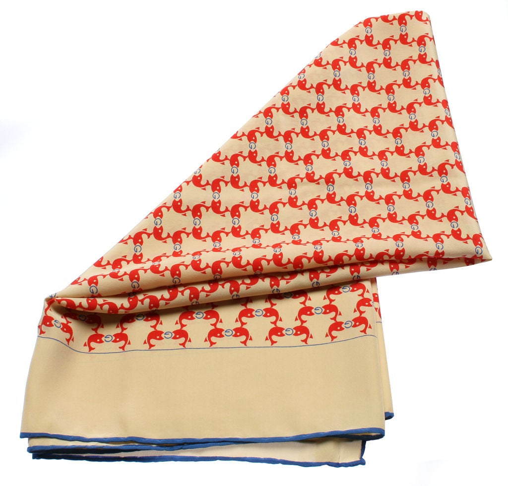 This  vintage Gucci scarf has a wonderful overall pattern featuring red fish eating blue G's. Really fun and so Gucci!