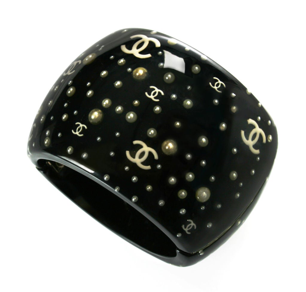 This is a spectacular and rare black resin and pearl prototype bracelet. The oval dimensions are 3 1/4