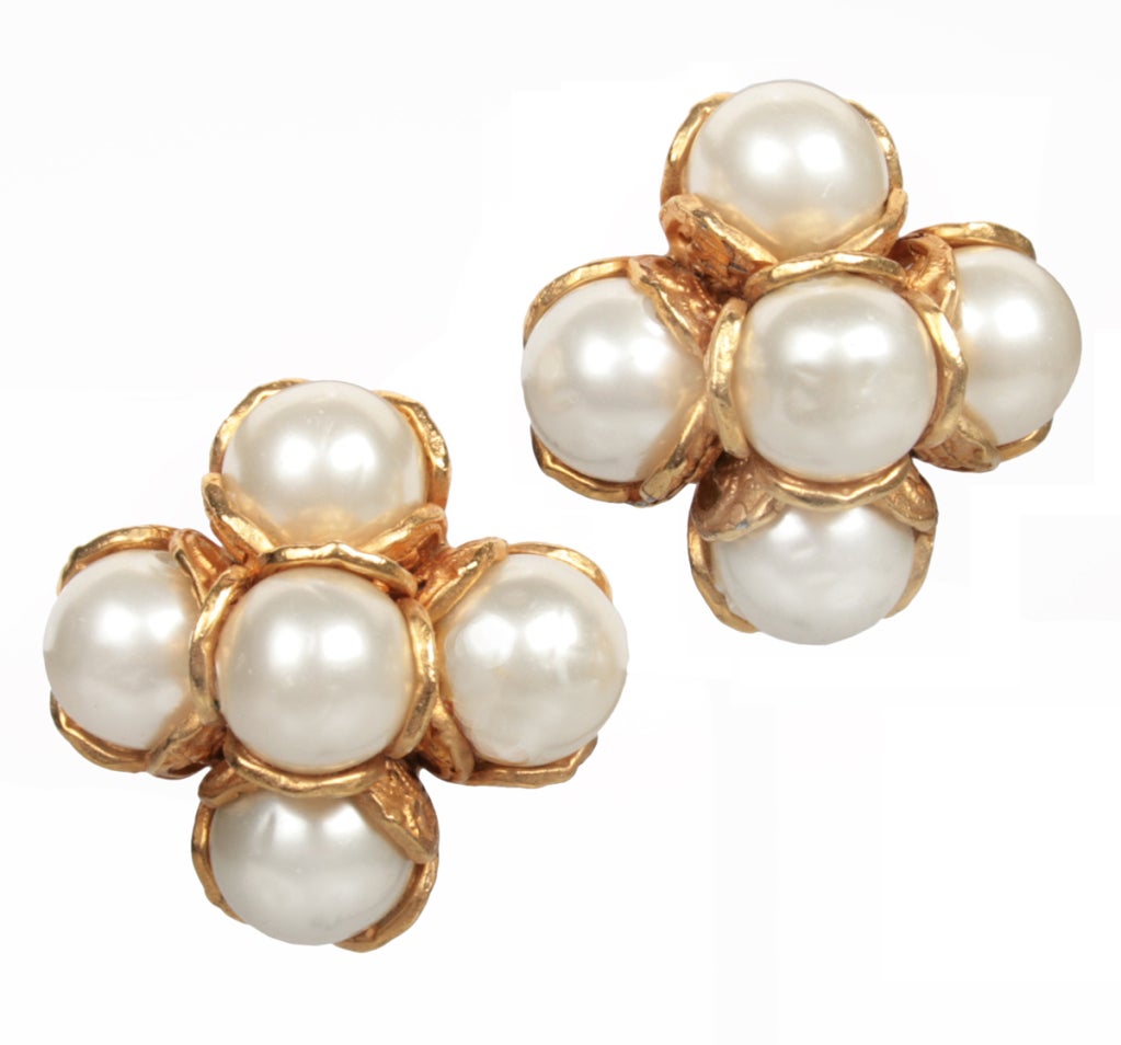 These are elegant faux pearl earrings by CHANEL. They are marked CHANEL, 94,P for Spring and Made in France.
They measure 1-1/4" in diameter.