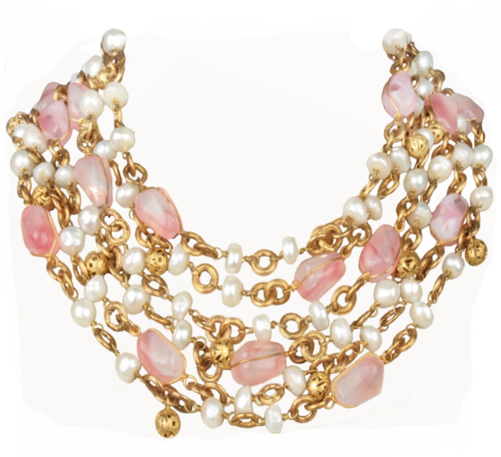 This is a  lovely multi strand gold tone Chanel necklace with wired pink gripoix 