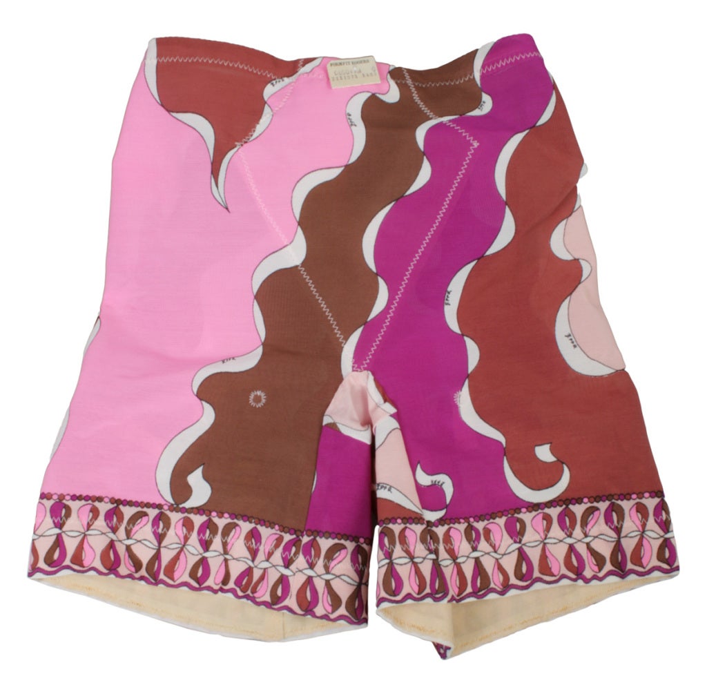 This is a rare vintage Pucci girdle that make the perfect Yoga shorts, in a mod, iconic Pucci design. These shorts are in the pink and warm tones complete with its original tags. There are six garters.