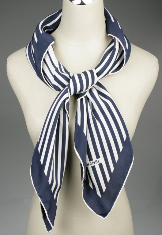 This is graphic navy and white CHANEL logo scarf.