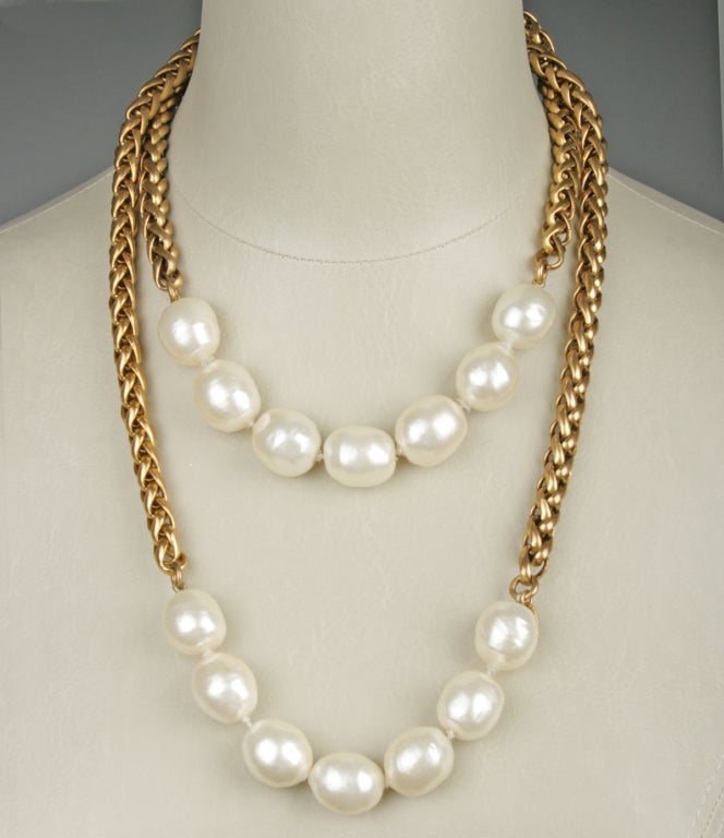 This is a  versatile necklace from Chanel that can be worn in several ways. Large Baroque pearls measure 3/4 