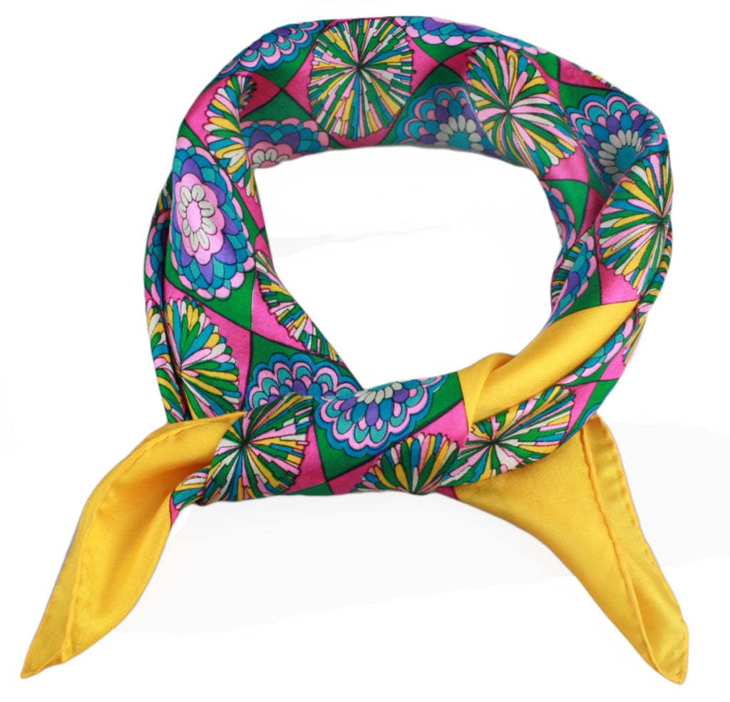 This is a vibrant and fun silk scarf with an interesting 1970's design by Schiaparelli and hand rolled by Glentey.