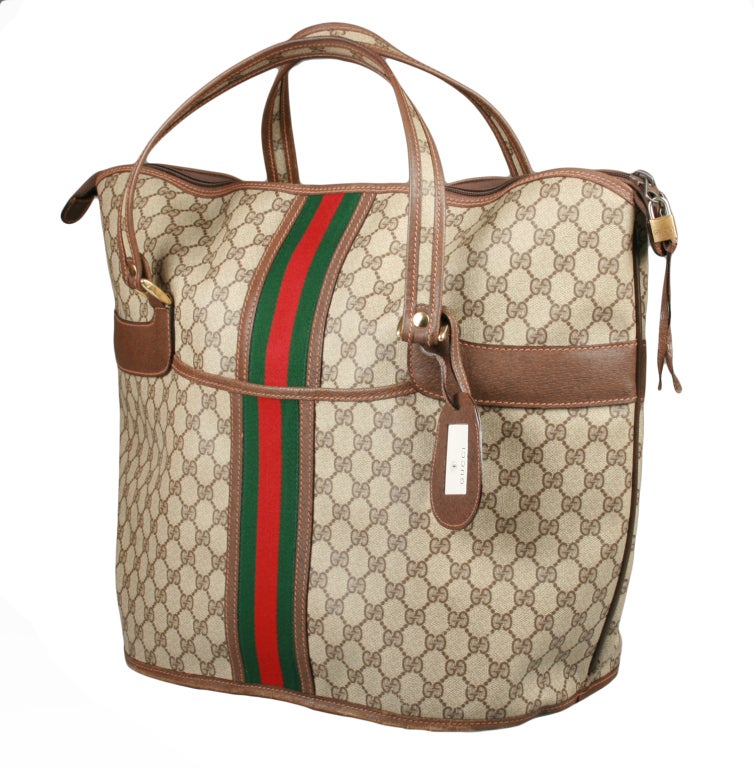 This is an absolutely fabulous vintage Gucci Tote. It is large enough to hold everything!