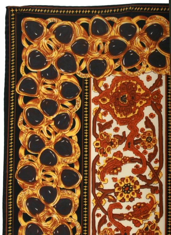 This is an unusual and beautiful CHANEL Scarf in the warm tones.  It has a great border of jewels.