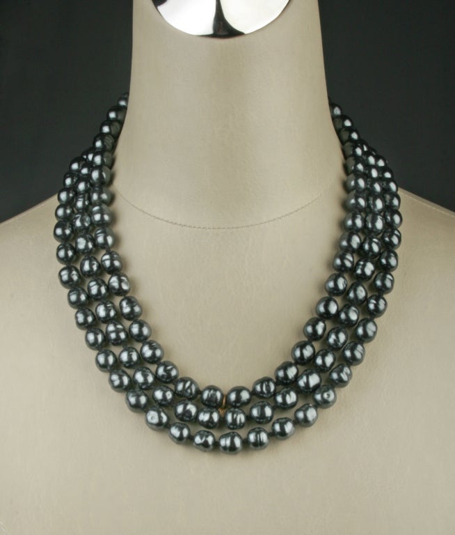 This is a stunning black baroque strand of pearls by CHANEL. This is a elegant worn by itself or layered with other CHANEL pieces. The pearls measure approximately 8mm in diameter. Total length is 64 