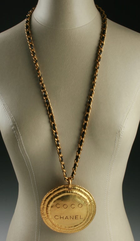 This is a monumental medallion necklace.  Really fun and a great layering piece! The chain length is 33". The medallion measures 3.5" in diameter and is marked for the Spring season of 1994.