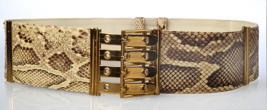 This is an exceptional python skin belt. It adjusts from a 27