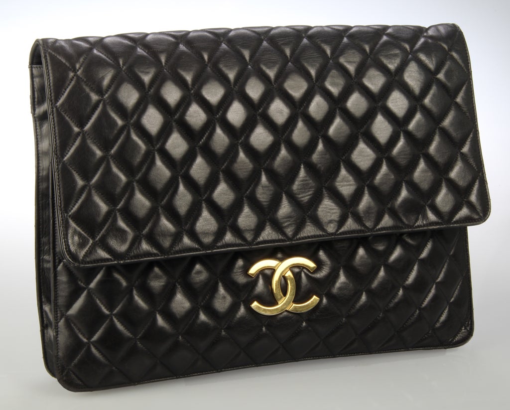 This is a stunning Chanel bag in quilted soft calfskin. The interiorof the bag is large and roomy. There is a large zippered compartment on the inside of the front and back panels. There is an additional zippered compartment on the back  This can be