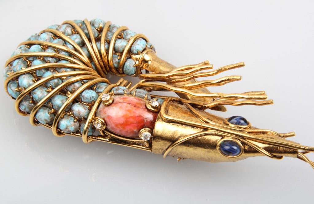 This is early Iradj brooch exhibits beautiful construction.  Statement making, it is also a beautiful object. It is encrusted with rhinestones,and glass stones.