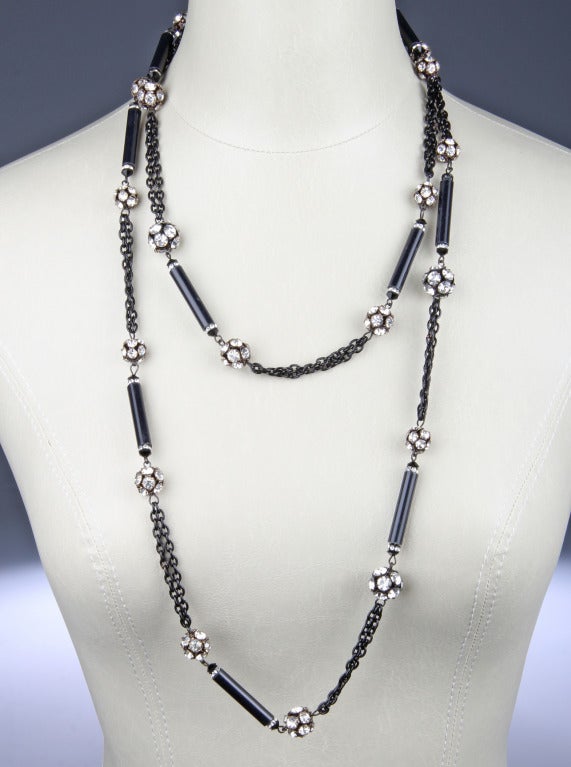 This elegant necklace works well day or night.  Made of black glass rods with rondelles covered in rhinestones.
Each rondelle is 1/2