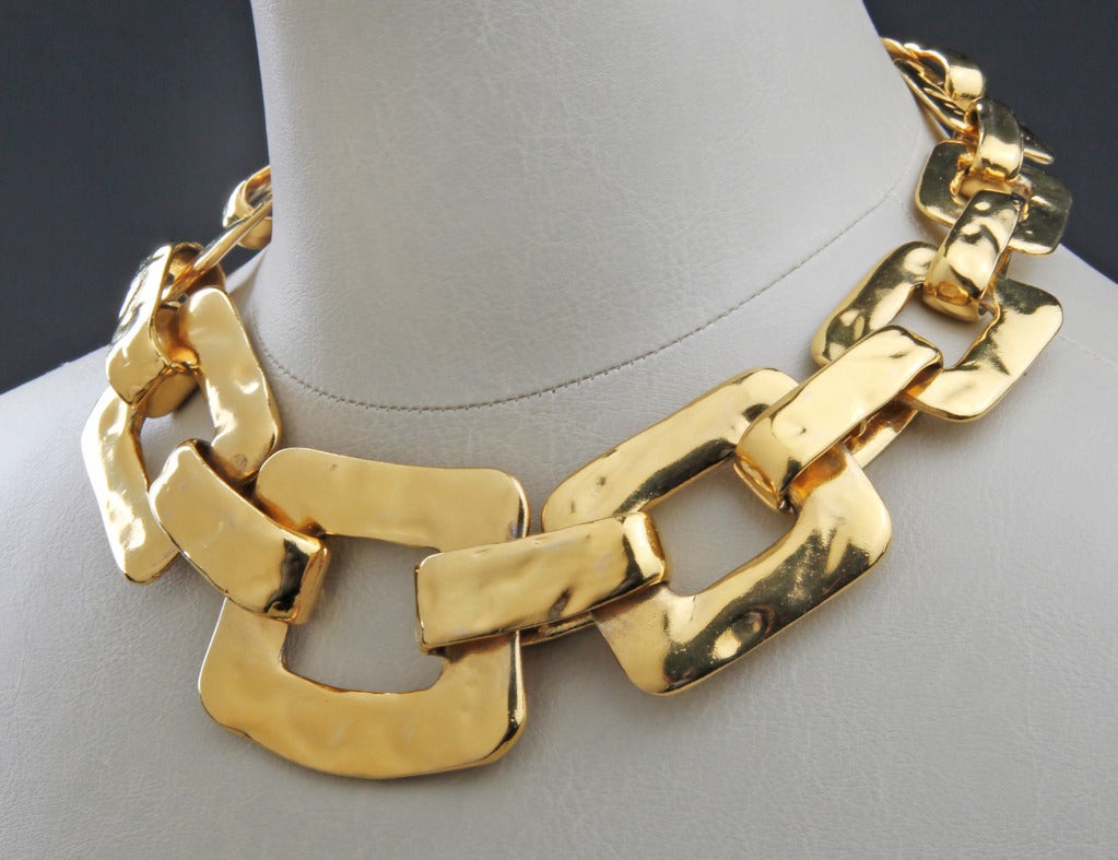 This is fabulous and rich looking.  This statement making necklace has over sized links  that are heavily gilt.  It is a signed and is a limited edition, numbering 284 out of 425.