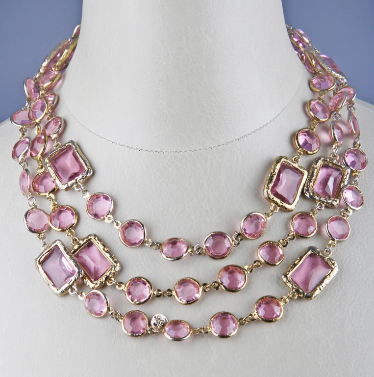 This is a beautiful pink CHANEL jewelled  glass necklace. This is a great layering piece.  This necklace can be worn long or doubled.
Stamped Chanel 1981