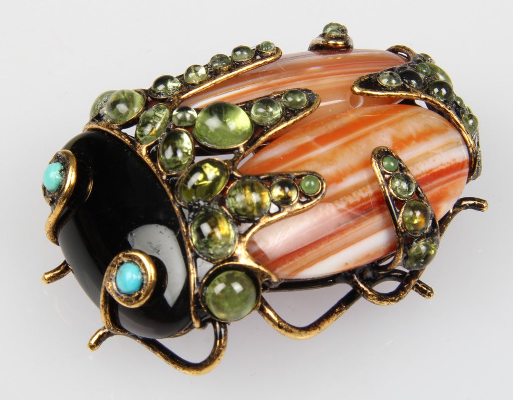 This is a wonderfully crafted, charming glass and semi precious jeweled scarab brooch