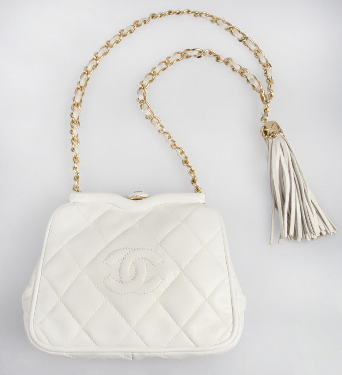 This is a lovely, versatile  small leather quilted bag by Chanel. This fanny pack handbag, or shoulderbag has one interior zippered pocket. The strap could also be worn as a belt!
The hook on the strap allows the strap to be shortened to your