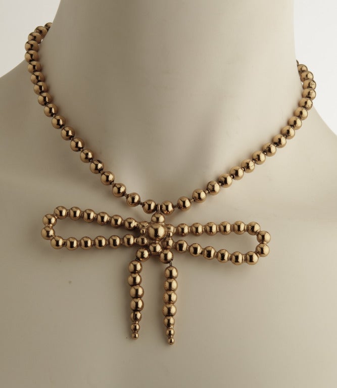 Yves St. Laurent  Gold Toned Bead Necklace with Bow 2