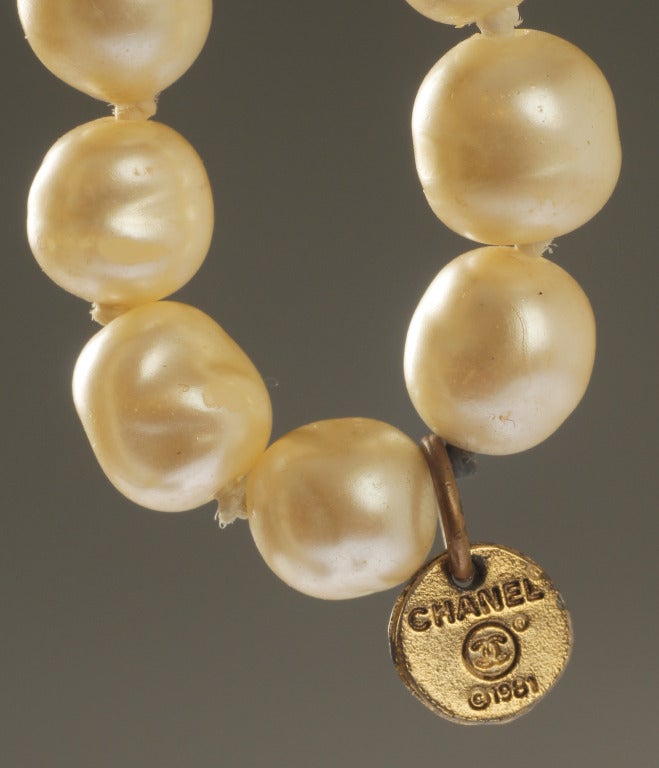 This is pearl necklace is a great length.  It can be worn opera length, doubled, or tripled or knotted. Fabulous alone or worn with other sautoirs, this is a great CHANEL piece.